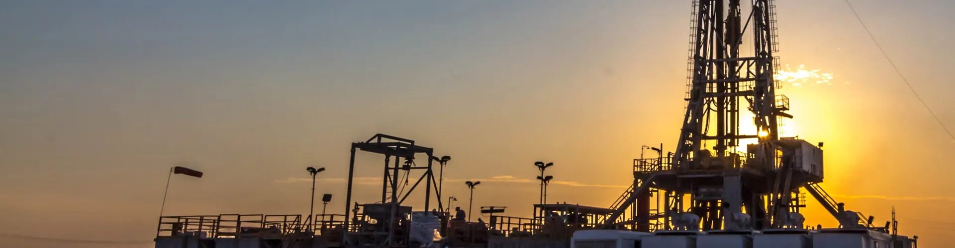 Drilling operation site at sunset