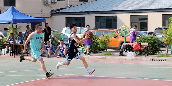 Athlete running toward the basketball hoop