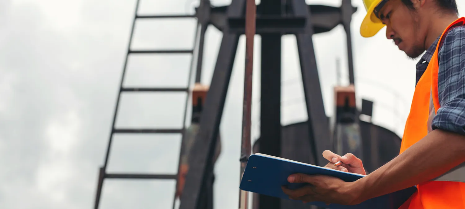 Personnel recording data at the drilling operation site