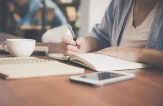 Personnel working at a desk